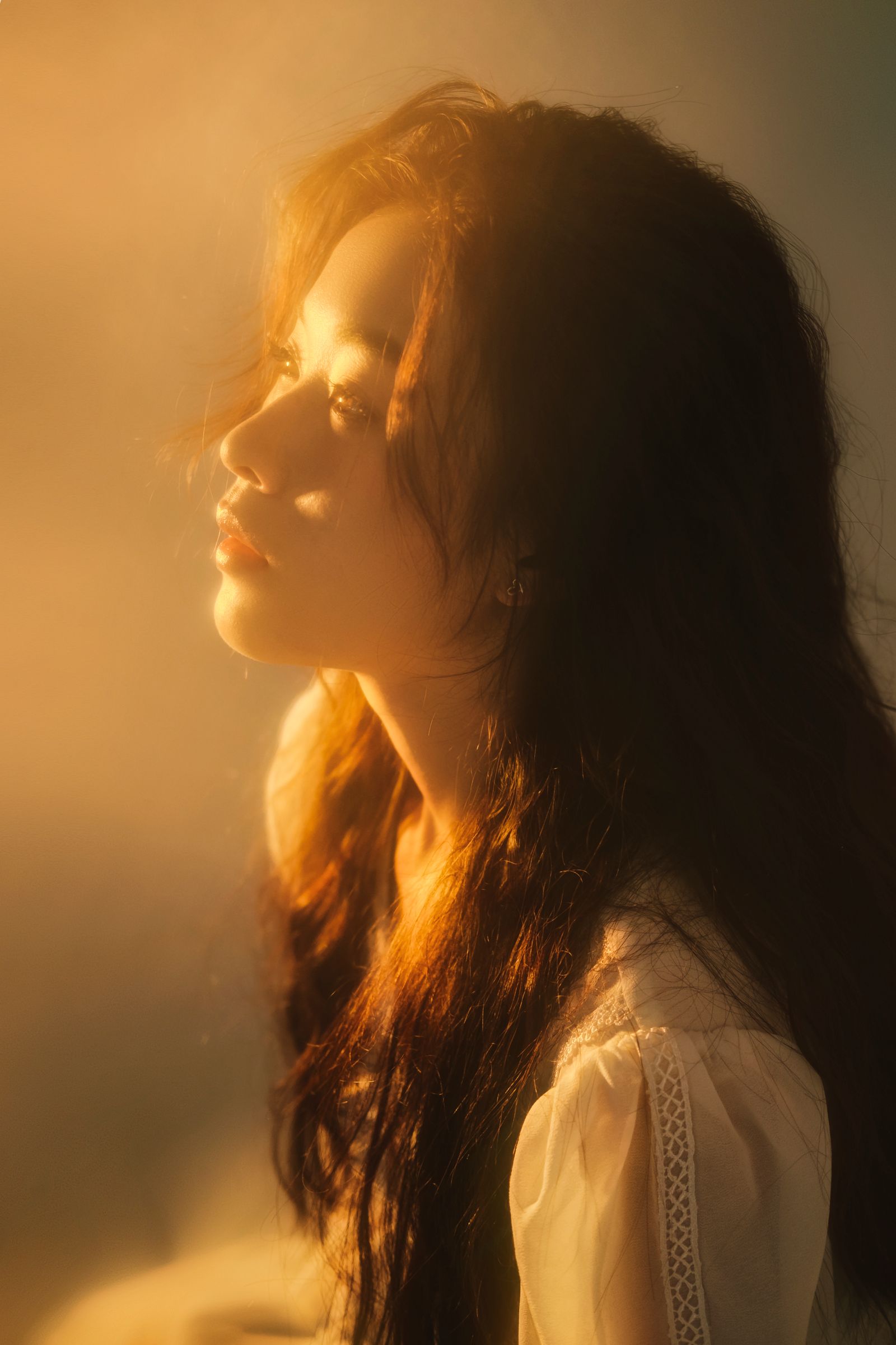 Soft, luxurious beauty portrait in warm light